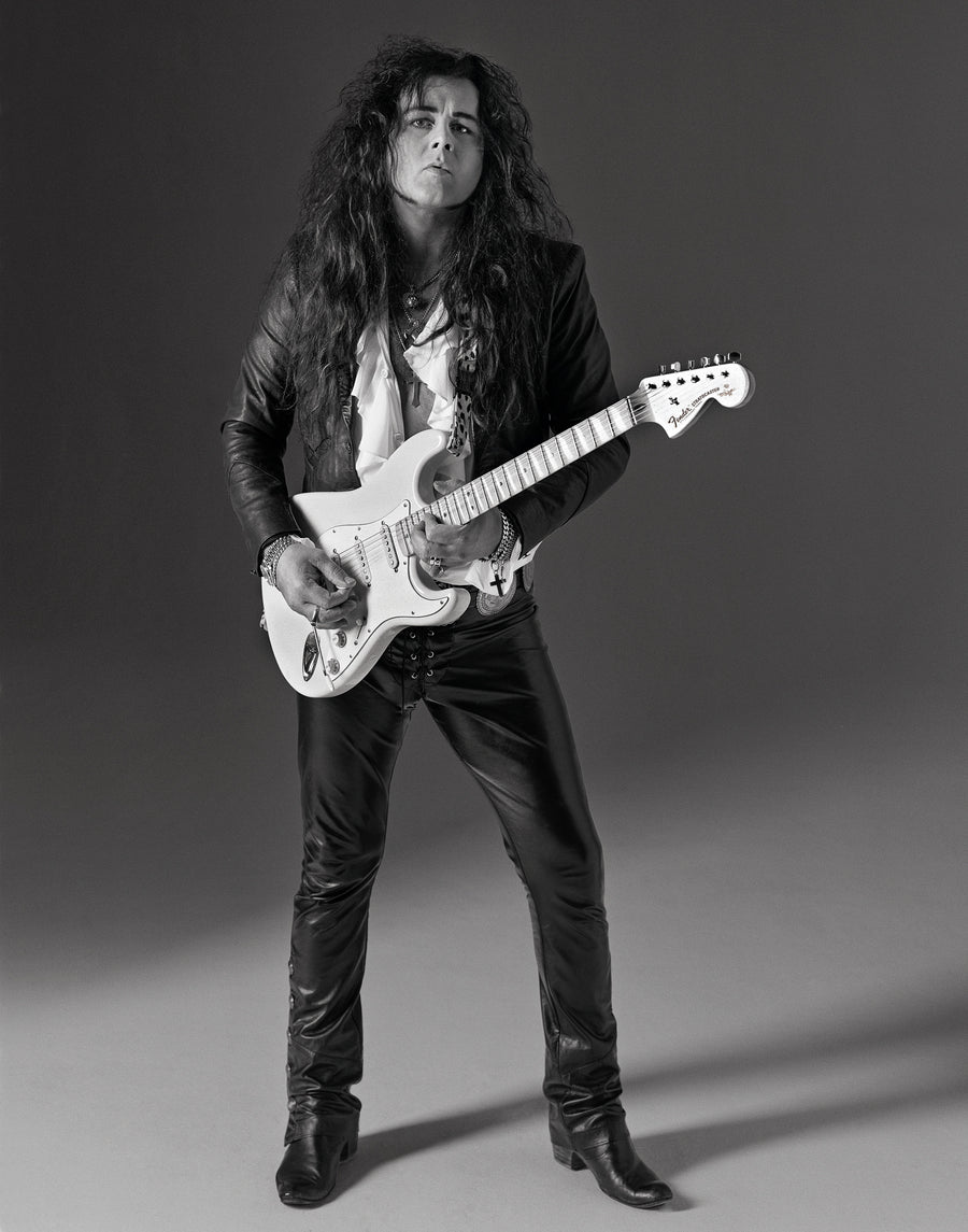 Yngwie Malmsteen full length with a white Stratocaster in a studio portrait, Los Angeles